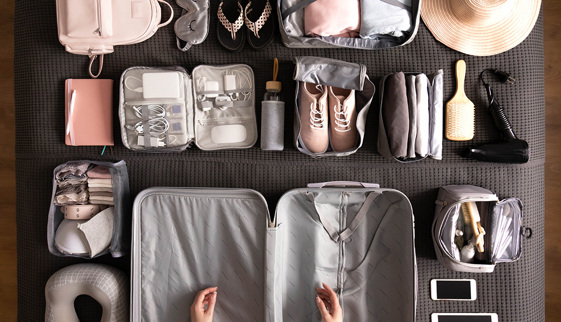 Woman Packing Suitcase For Travelling